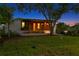 Inviting single-story home with a modern facade, front lawn, and mature landscaping at 500 38Th Ne Ave, St Petersburg, FL 33704