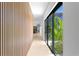 Hallway leading to the kitchen and dining area with view of garden at 500 38Th Ne Ave, St Petersburg, FL 33704