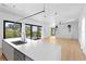 Open concept kitchen with a large kitchen island overlooking the home's bright and airy living spaces at 500 38Th Ne Ave, St Petersburg, FL 33704