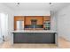 Modern kitchen with stainless steel appliances, center island, and sleek wood cabinetry at 500 38Th Ne Ave, St Petersburg, FL 33704