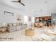 Bright and airy living room with modern decor and an open floor plan leading to the kitchen at 500 38Th Ne Ave, St Petersburg, FL 33704