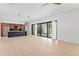 Bright and spacious living room with modern design, hardwood floors, and large sliding glass doors at 500 38Th Ne Ave, St Petersburg, FL 33704