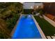 Stunning backyard features an inviting pool and spa with lush landscaping at 500 38Th Ne Ave, St Petersburg, FL 33704