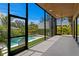 Indoor-outdoor living with screened lanai views of the clear blue pool and lush landscaping at 500 38Th Ne Ave, St Petersburg, FL 33704