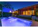 The backyard has a sparkling pool, spa, wood-look screened-in patio, and lush tropical landscaping at 500 38Th Ne Ave, St Petersburg, FL 33704