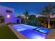 Beautiful pool and spa combination with modern design, palm trees, and evening lighting at 500 38Th Ne Ave, St Petersburg, FL 33704