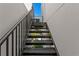 A modern black staircase provides access to upper levels, offering a sleek and functional design element at 500 38Th Ne Ave, St Petersburg, FL 33704
