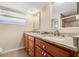 Elegant bathroom featuring dual sinks, granite countertops, and a spacious vanity for added luxury at 5208 Denver Ne St, St Petersburg, FL 33703