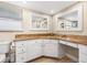 Bathroom with granite countertops, ample cabinet storage, dual mirrors, and bright, natural lighting at 5208 Denver Ne St, St Petersburg, FL 33703