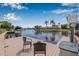 Waterfront dock featuring seating, lift, and a stunning view of the canal at 5208 Denver Ne St, St Petersburg, FL 33703