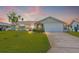 Charming single-story home featuring a well-manicured lawn and a spacious two-car garage at 5208 Denver Ne St, St Petersburg, FL 33703