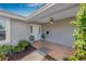 Charming front entrance with a covered porch, stylish light fixture, and well-maintained landscaping at 5208 Denver Ne St, St Petersburg, FL 33703