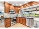 Gourmet kitchen area featuring stainless steel appliances, granite countertops, and plenty of cabinet space at 5208 Denver Ne St, St Petersburg, FL 33703