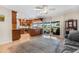 Spacious kitchen featuring wood cabinetry, stainless steel appliances, and a large window overlooking the outdoor living area at 5208 Denver Ne St, St Petersburg, FL 33703