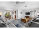 Bright and airy living room with comfortable seating, hardwood floors, and an adjacent dining area at 5208 Denver Ne St, St Petersburg, FL 33703