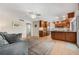 Open concept living area with wood cabinets, stainless steel appliances and view to the next room at 5208 Denver Ne St, St Petersburg, FL 33703
