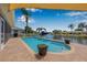 Enjoy Florida living in this beautiful pool with water views and tropical landscaping at 5208 Denver Ne St, St Petersburg, FL 33703