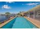 Inviting pool with lovely fountains and access to a covered lanai on the canal at 5208 Denver Ne St, St Petersburg, FL 33703