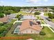 Aerial view of a backyard featuring a pool and solar panels on the roof at 5405 El Cerro Dr, New Port Richey, FL 34655