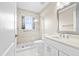 Bright bathroom with a glass-enclosed shower, a modern sink and a neutral color palette at 5405 El Cerro Dr, New Port Richey, FL 34655