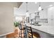 Modern kitchen featuring granite countertops, stainless steel appliances, and white cabinets at 5405 El Cerro Dr, New Port Richey, FL 34655