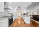 Bright white kitchen featuring granite countertops and stainless steel appliances at 5405 El Cerro Dr, New Port Richey, FL 34655