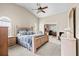 Vaulted ceiling bedroom features a ceiling fan, soft carpet, and an adjoining sitting room at 5405 El Cerro Dr, New Port Richey, FL 34655