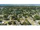 Aerial shot of the home in a well-established neighborhood surrounded by mature trees and lush landscaping at 5413 15Th Ave S, Gulfport, FL 33707
