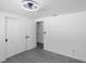 This bright bedroom has light grey floors, a fan and two closets at 5413 15Th Ave S, Gulfport, FL 33707