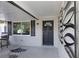 Inviting front porch with stylish decor and a cozy seating area at 5413 15Th Ave S, Gulfport, FL 33707