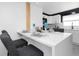 Modern kitchen features a waterfall countertop breakfast bar with seating for three at 5413 15Th Ave S, Gulfport, FL 33707
