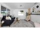 Bright living room featuring a cozy sofa, modern decor, and ample natural light at 5413 15Th Ave S, Gulfport, FL 33707
