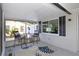 Relaxing screened patio with a seating area, perfect for enjoying the outdoors at 5413 15Th Ave S, Gulfport, FL 33707