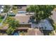 Bird's eye view of the backyard including a small screened-in patio and fenced-in yard at 5413 15Th Ave S, Gulfport, FL 33707