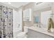 The bathroom has a shower over tub, a toilet and a vanity with a sink at 5492 Summer Sunset Dr, Apollo Beach, FL 33572