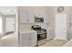 Well-lit kitchen with stainless appliances, ample counter space, and neutral walls at 5492 Summer Sunset Dr, Apollo Beach, FL 33572