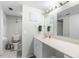 The bathroom features a vanity, sink, framed mirror, and a toilet at 5915 Sea Ranch Dr # 202, Hudson, FL 34667