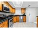Modern kitchen with stainless steel appliances, black countertops, and plenty of storage space at 5915 Sea Ranch Dr # 202, Hudson, FL 34667