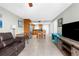 Spacious living space with an open floor plan connecting the kitchen, living room, and dining area at 5915 Sea Ranch Dr # 202, Hudson, FL 34667