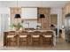 Bright kitchen featuring a waterfall island with seating and stylish pendant lighting at 620 Marmora Ave, Tampa, FL 33606