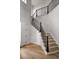 Elegant staircase with wood treads and black iron railing, leading to the upper level at 620 Marmora Ave, Tampa, FL 33606
