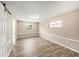 Neutral bedroom with hardwood floors and a pair of windows at 6241 Ansley St, Spring Hill, FL 34606