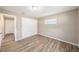 Bedroom with closet, hardwood floors and natural light at 6241 Ansley St, Spring Hill, FL 34606