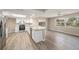 Bright kitchen featuring granite countertops, stainless steel appliances, and white cabinetry at 6241 Ansley St, Spring Hill, FL 34606