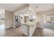 Modern kitchen with granite countertops, stainless steel appliances, and white cabinetry at 6241 Ansley St, Spring Hill, FL 34606