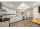 Modern kitchen featuring granite countertops, stainless steel appliances, and a breakfast bar area at 6241 Ansley St, Spring Hill, FL 34606