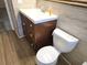 Bathroom with updated vanity, white countertop, and a modern toilet for a fresh and functional space at 6317 Buster Dr, Tampa, FL 33619