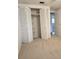 Spacious bedroom featuring a large closet with bi-fold doors and neutral carpeting throughout at 6317 Buster Dr, Tampa, FL 33619