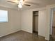 Bright bedroom featuring a ceiling fan, closet and window letting in natural light at 6317 Buster Dr, Tampa, FL 33619