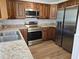 Well-equipped kitchen featuring stainless steel appliances, stylish cabinetry, and countertops at 6317 Buster Dr, Tampa, FL 33619